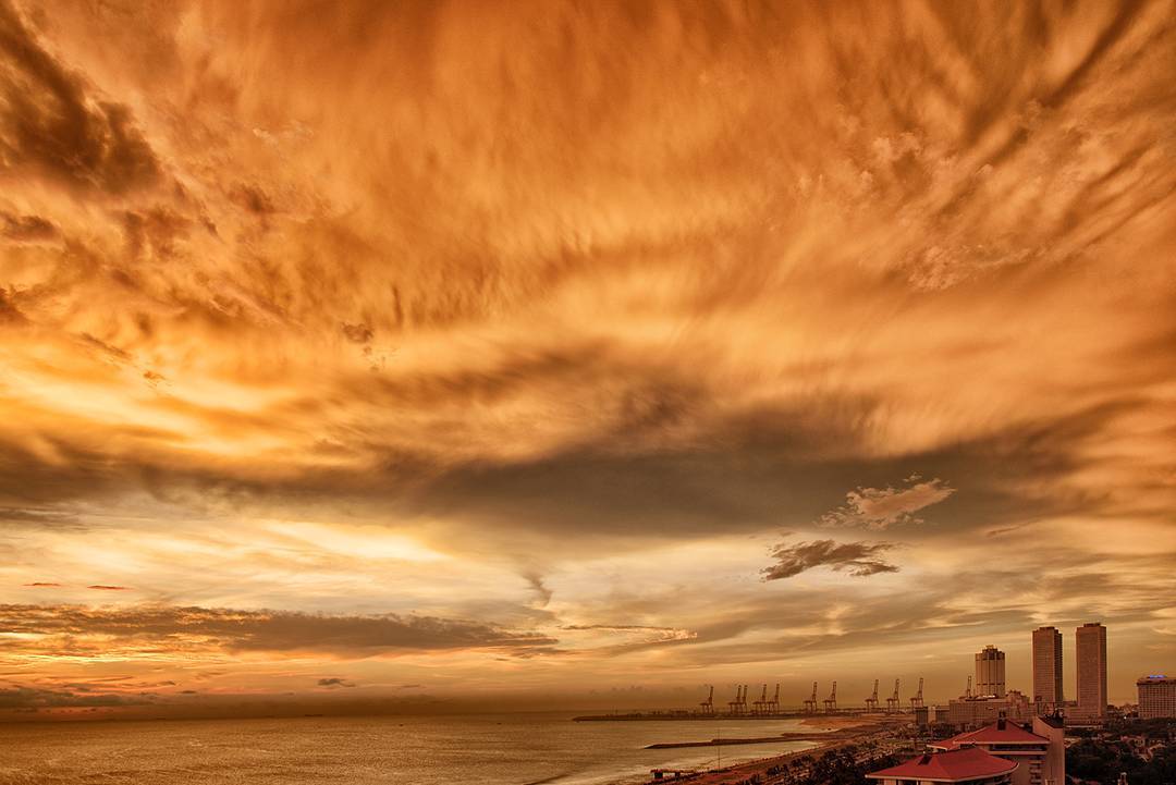 A freaky sunset in #SriLanka last year.  Kind of matches what I'm feeling about this #Monday at work after getting pulled into a conf call at home due to system issues.  The week is off to an #ominous start... and this comes after a full day on Saturday at work too (>_<) #Sunset #Clouds #Orange #Sky